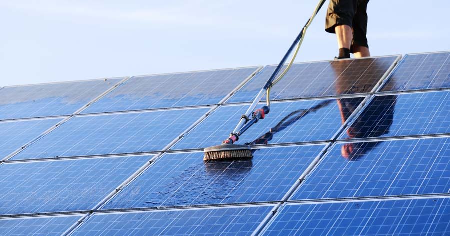 Cleaning a rooftop solar panel array